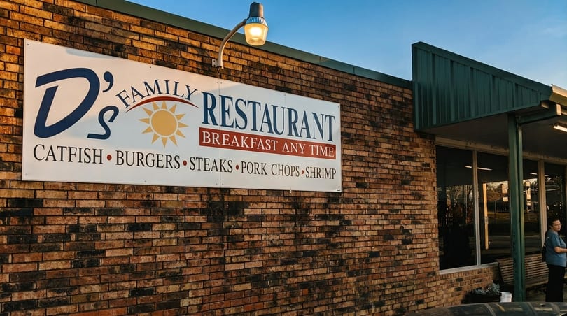 D's Family Restaurant sign on a brick building, listing "Breakfast Any Time" and menu items.